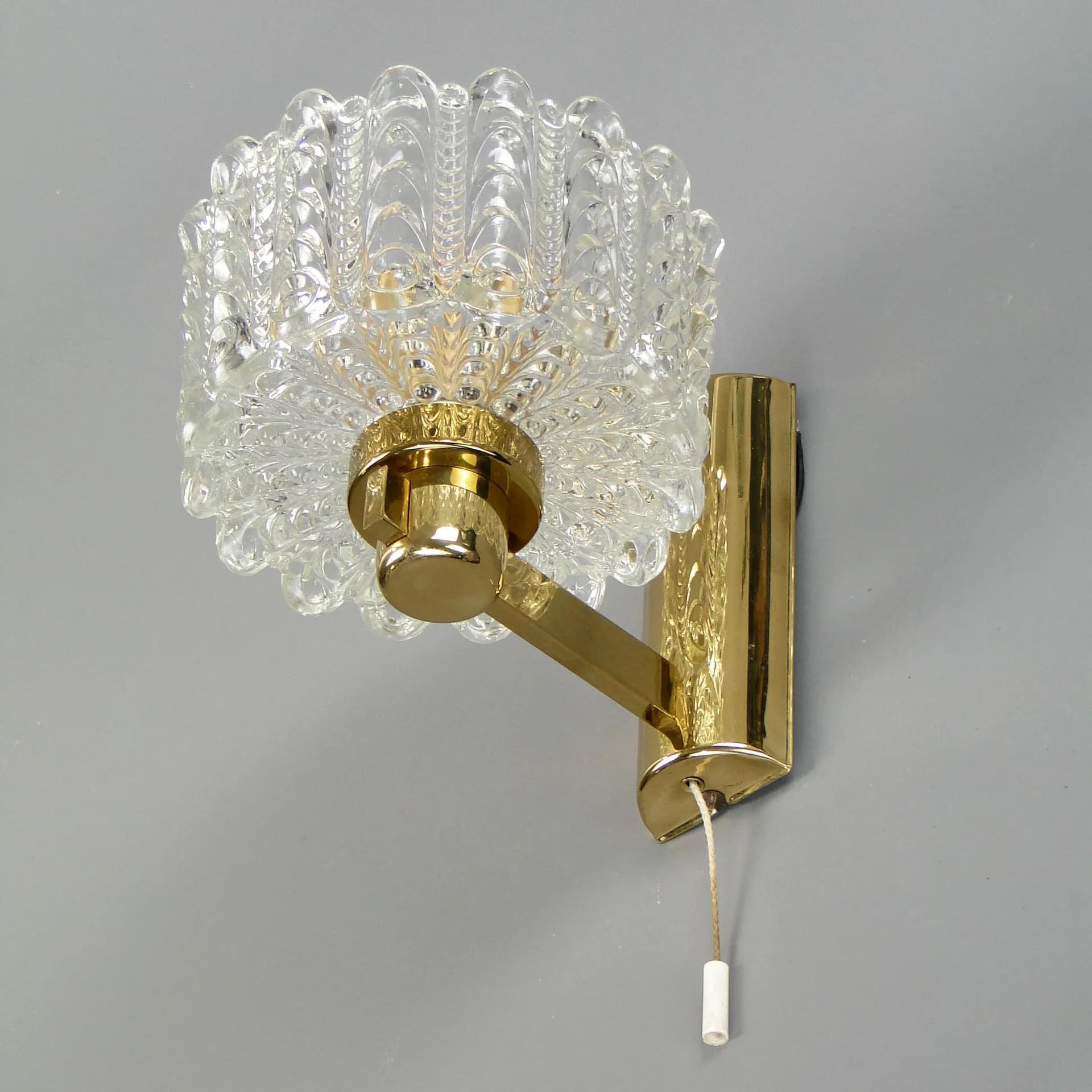 Wall light, transparent glass, brass, by C. Fagerlund, Orrefors, Sweden, 1960s. - 45357