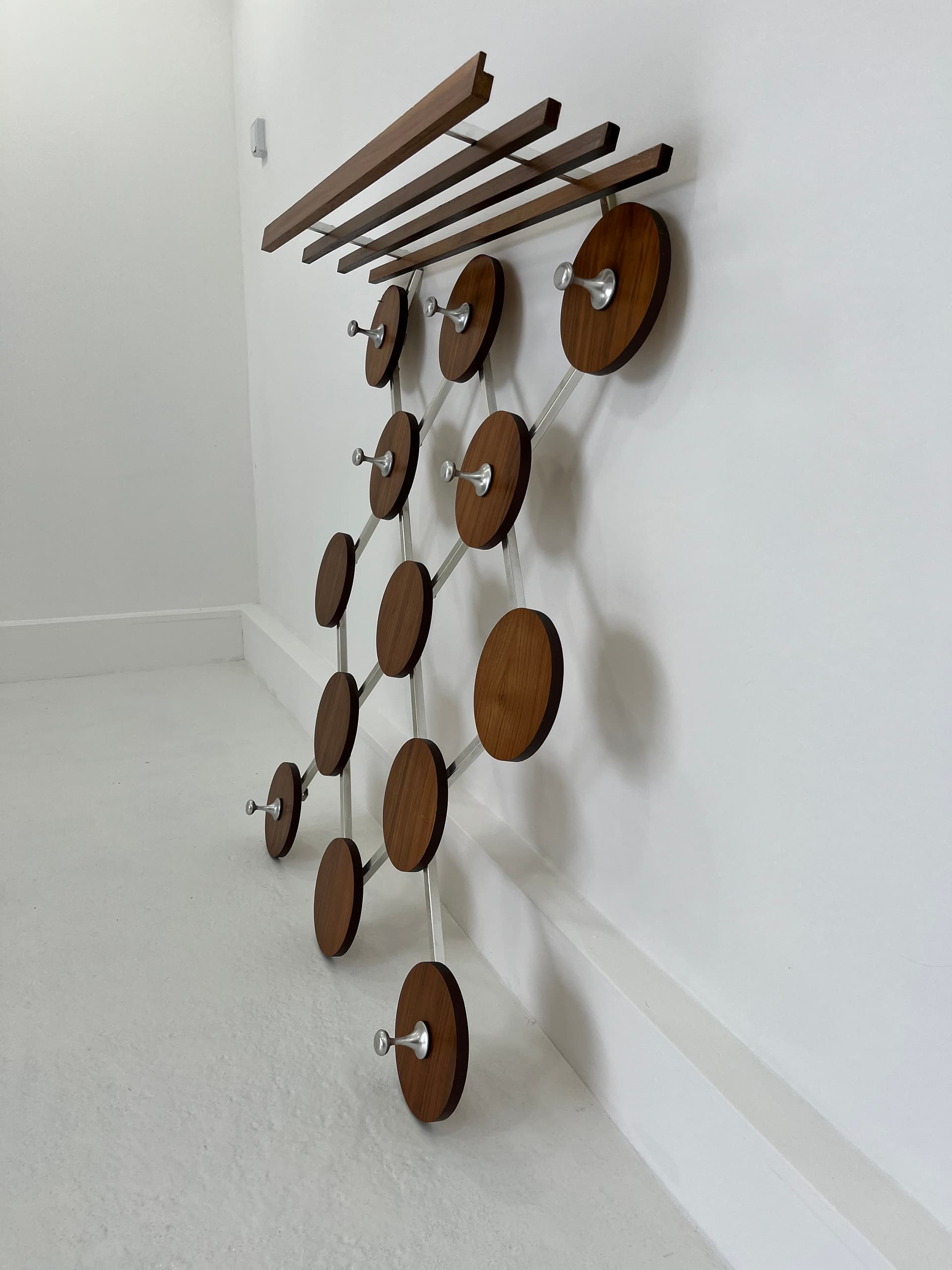 Wall-mounted rack, walnut, metal, Scandinavia, 1960s. - 45924