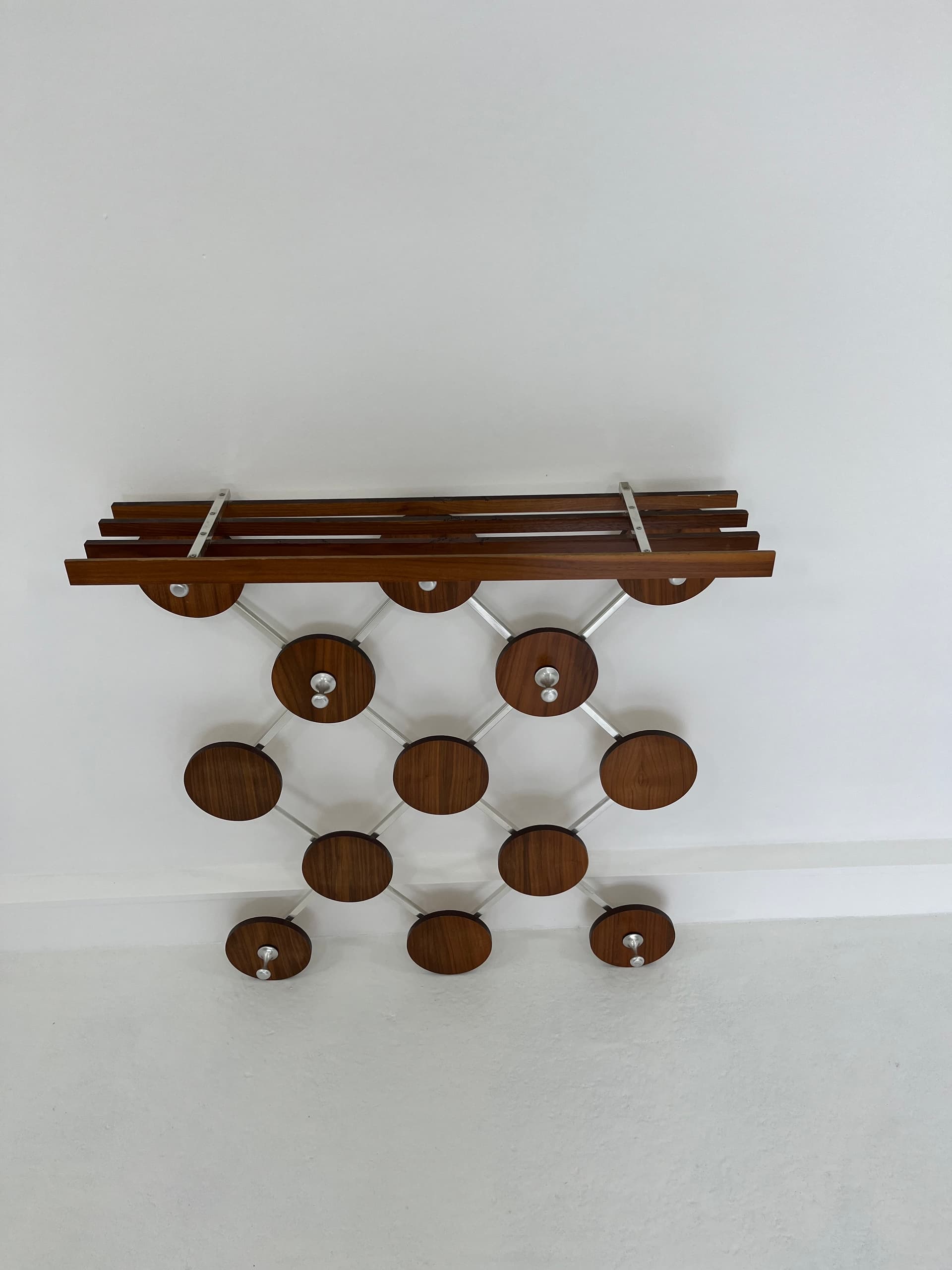 Wall-mounted rack, walnut, metal, Scandinavia, 1960s. - 45930