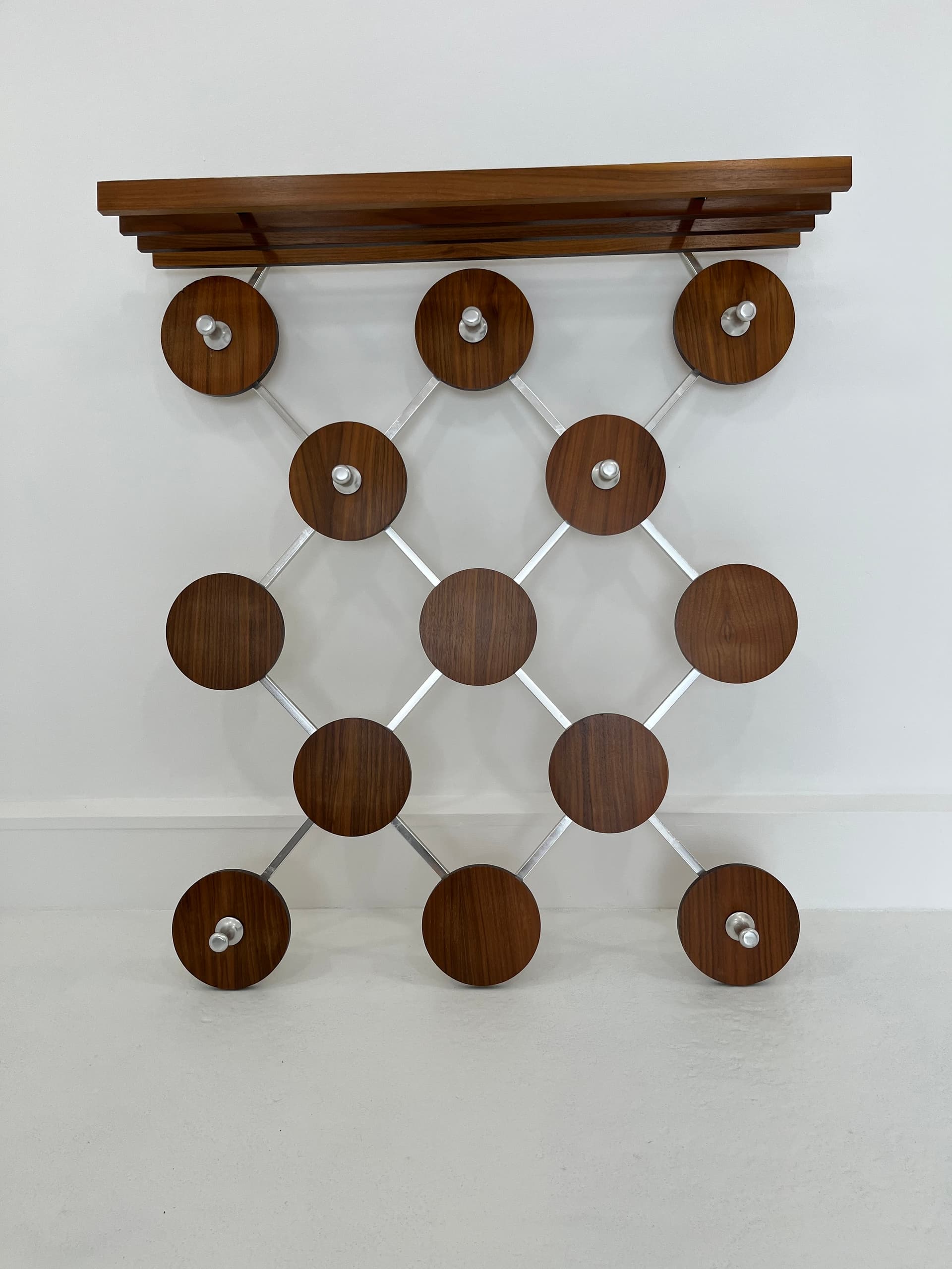 Wall-mounted rack, walnut, metal, Scandinavia, 1960s. - 45923