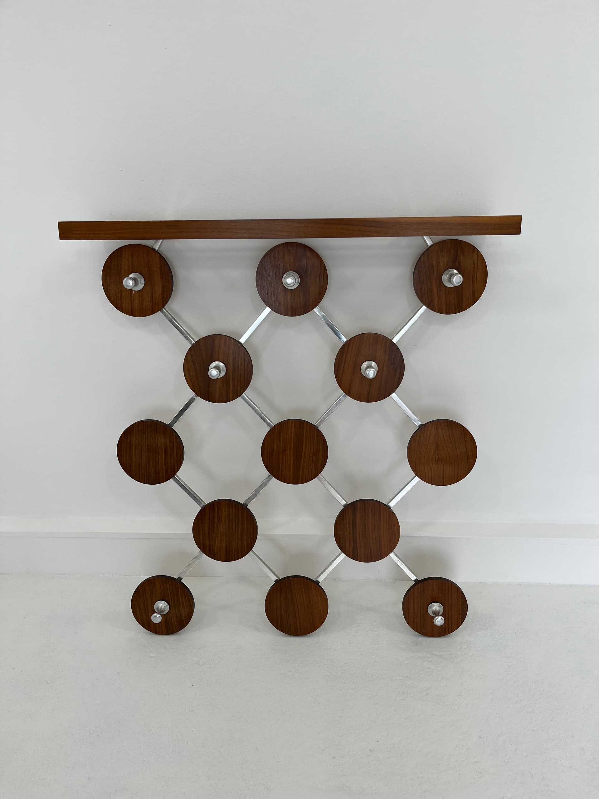 Wall-mounted rack, walnut, metal, Scandinavia, 1960s. - 45927