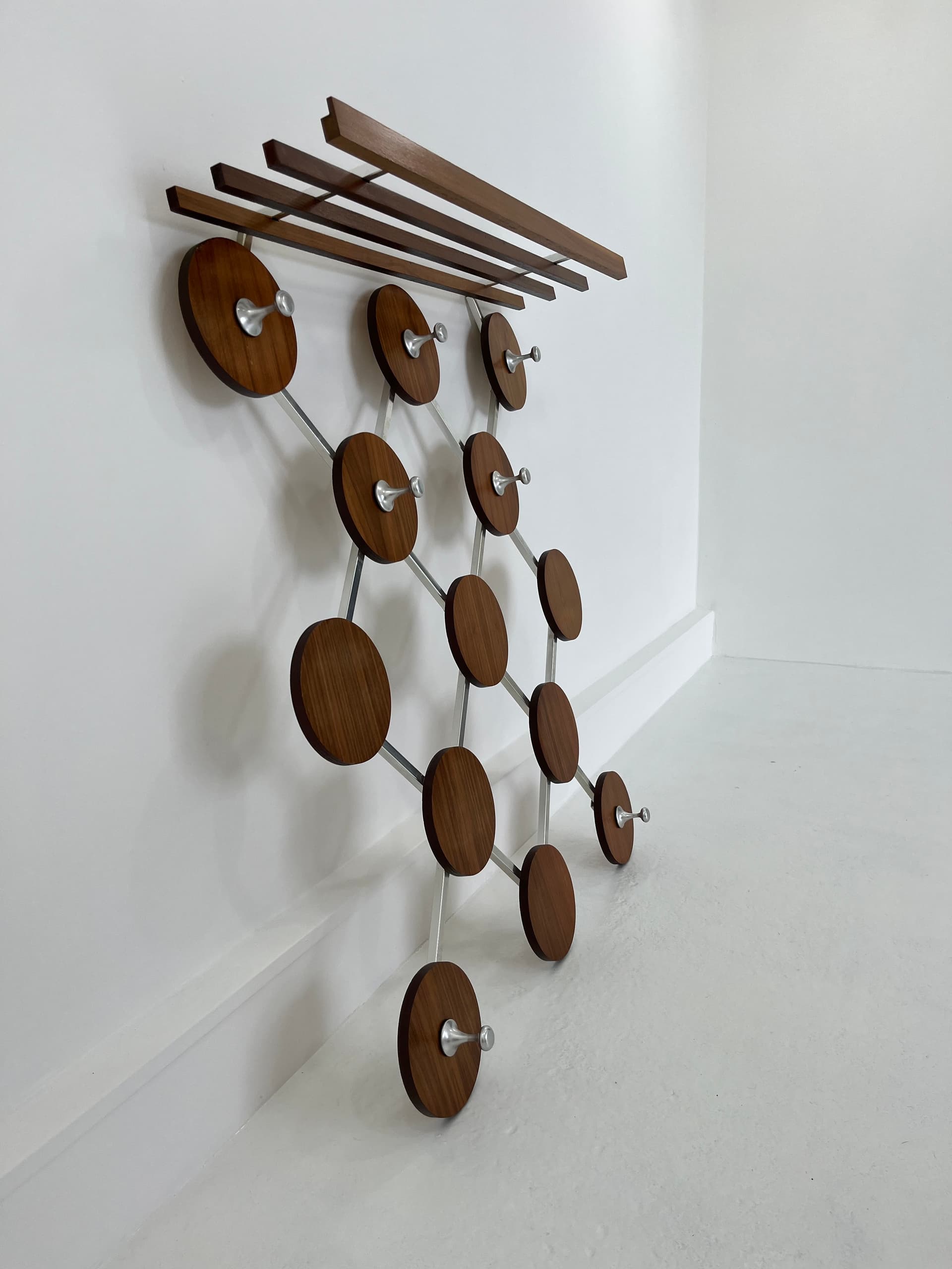Wall-mounted rack, walnut, metal, Scandinavia, 1960s. - 45929