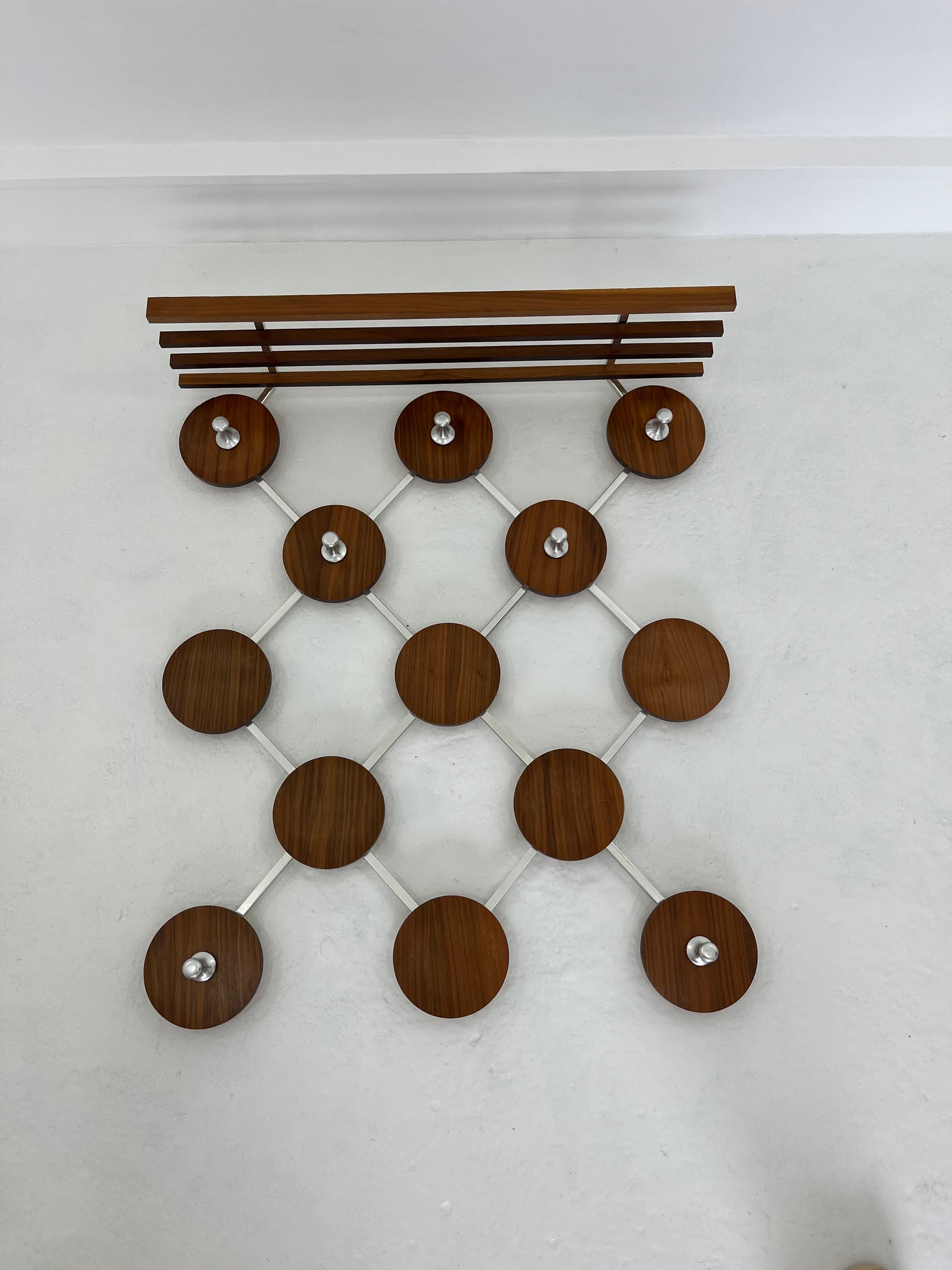 Wall-mounted rack, walnut, metal, Scandinavia, 1960s. - 45932