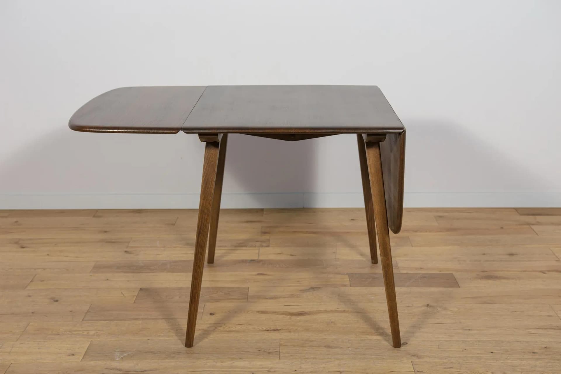 Drop-leaf dining table, brown, beech, by L. Ercolani, United Kingdom, 1960s. - 72056