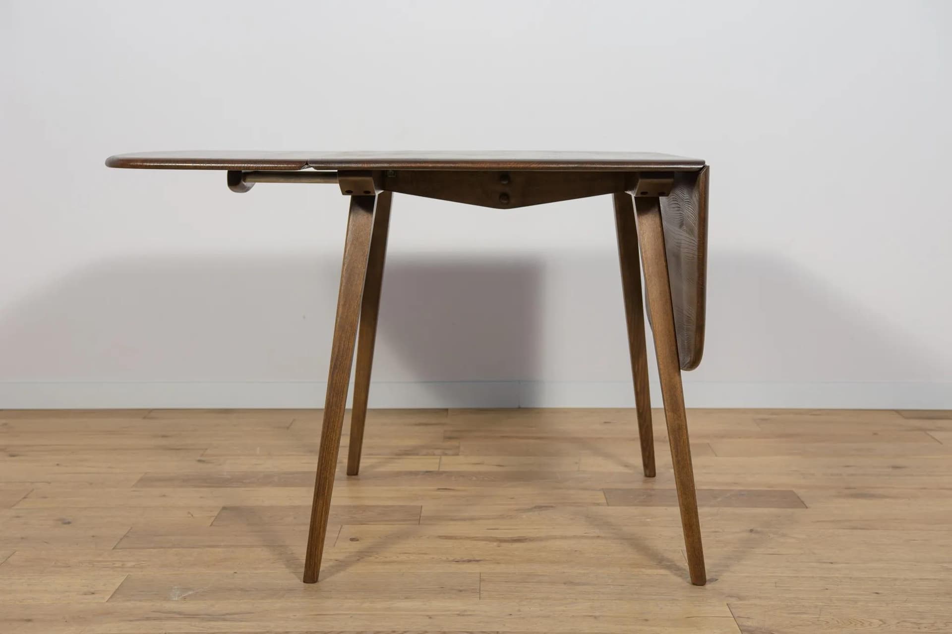Drop-leaf dining table, brown, beech, by L. Ercolani, United Kingdom, 1960s. - 72063