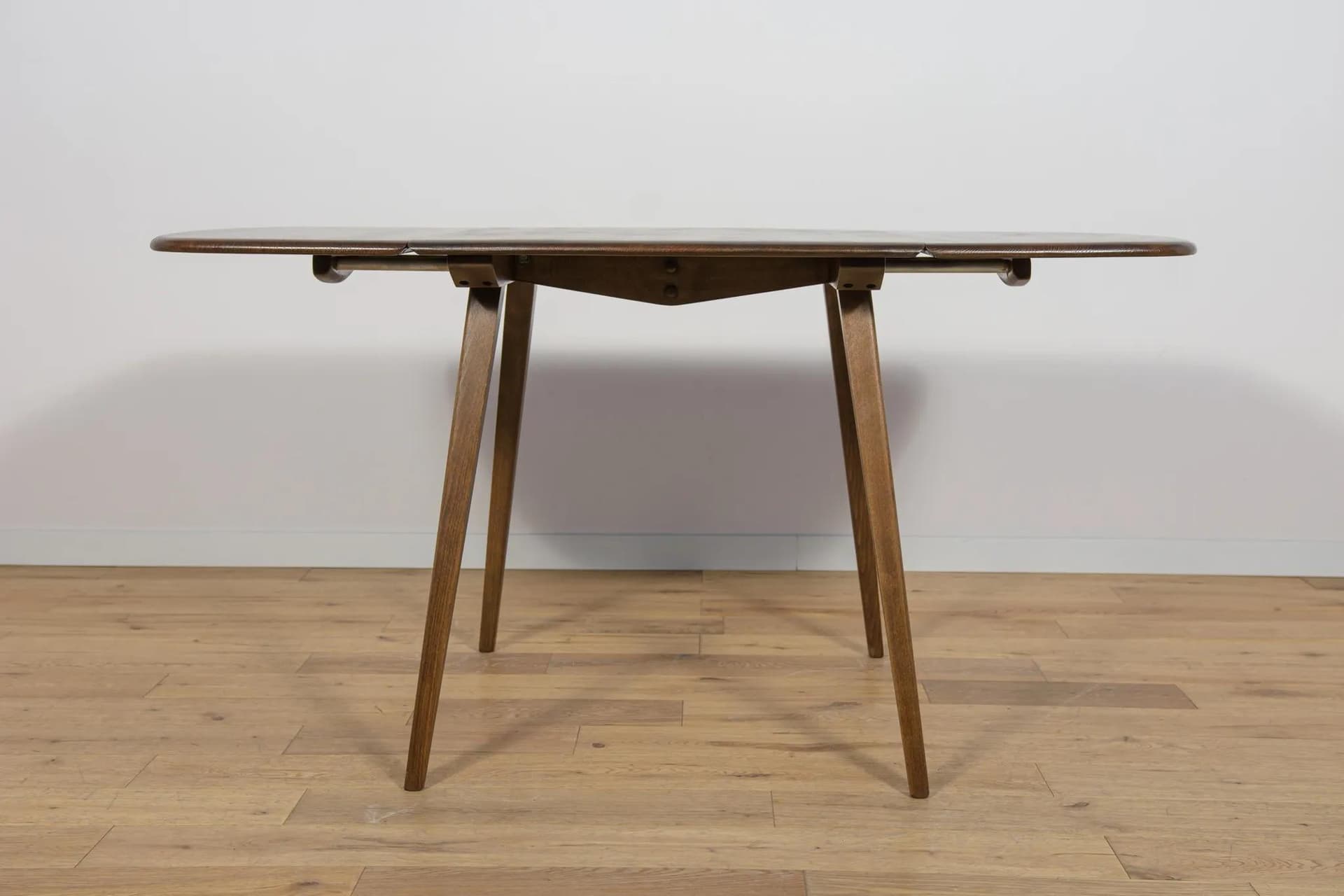 Drop-leaf dining table, brown, beech, by L. Ercolani, United Kingdom, 1960s. - 72058