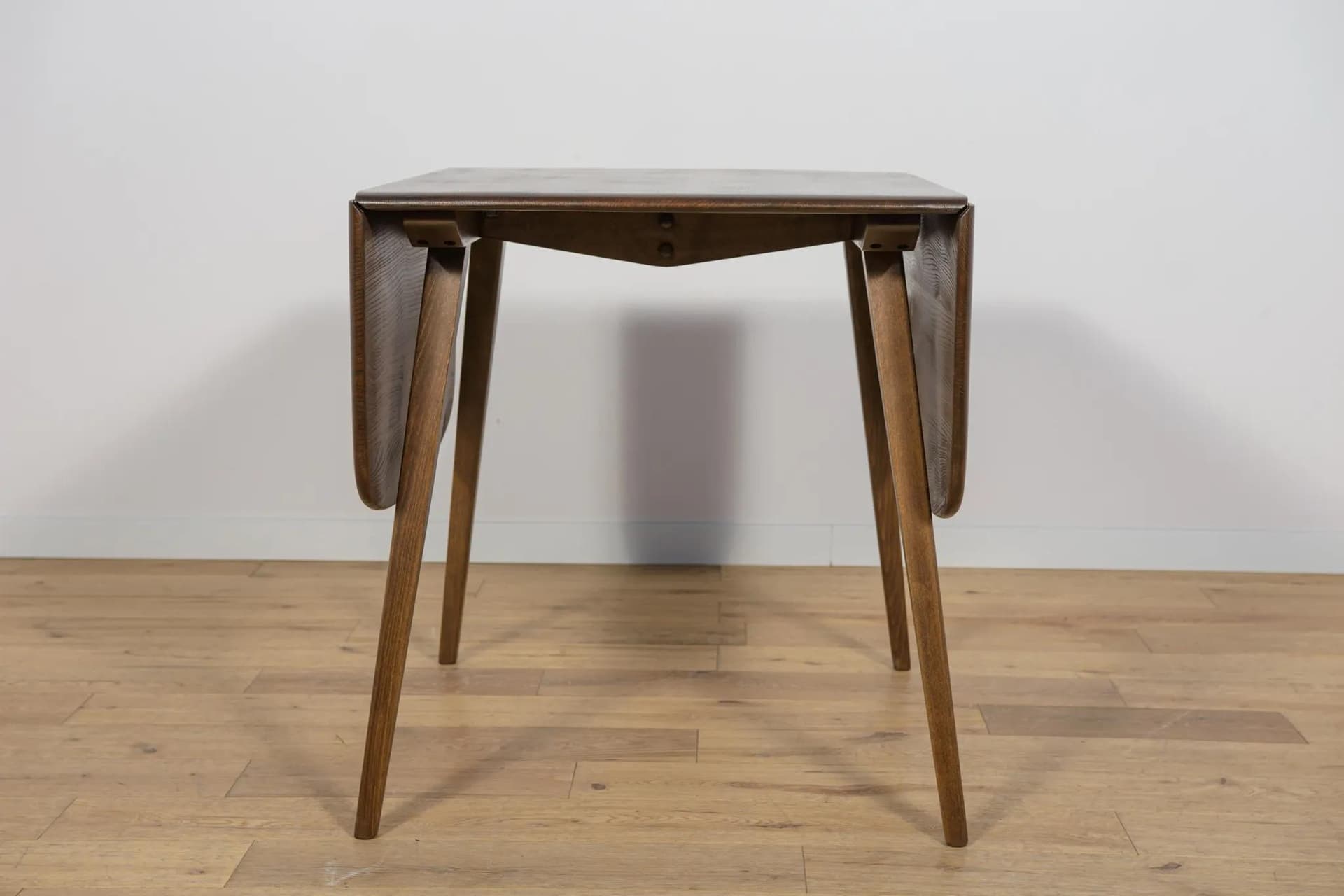 Drop-leaf dining table, brown, beech, by L. Ercolani, United Kingdom, 1960s. - 72055
