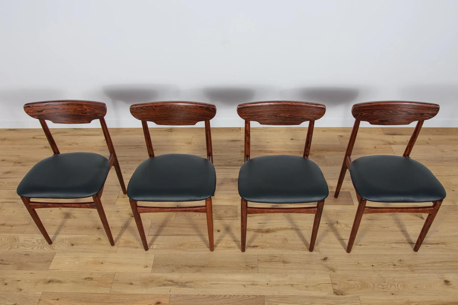 Set of four chairs, brown rosewood, black leather, Denmark, 1960s. - 71400