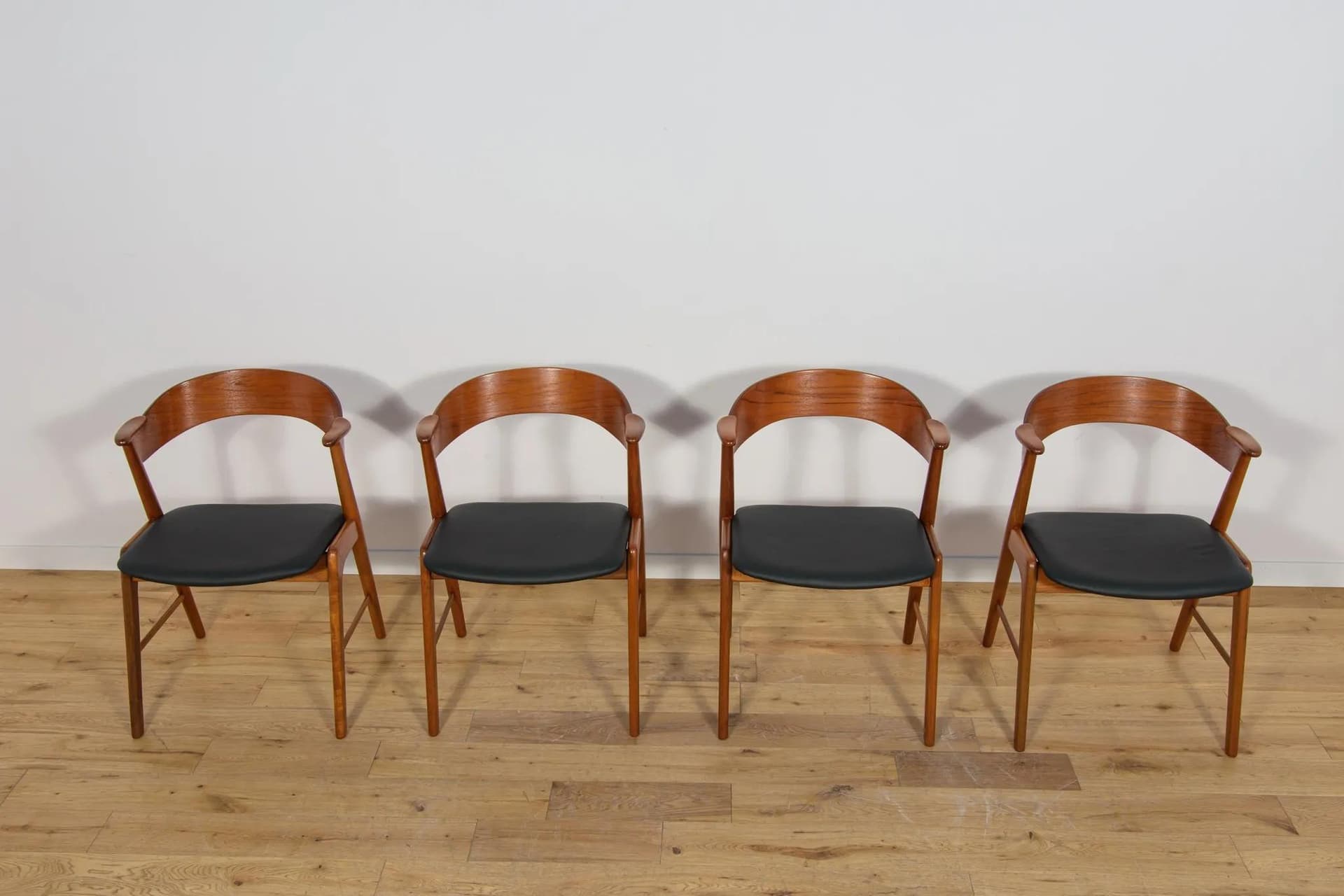 Set of four chairs, brown teak, black leather, Denmark, 1960s. - 70956