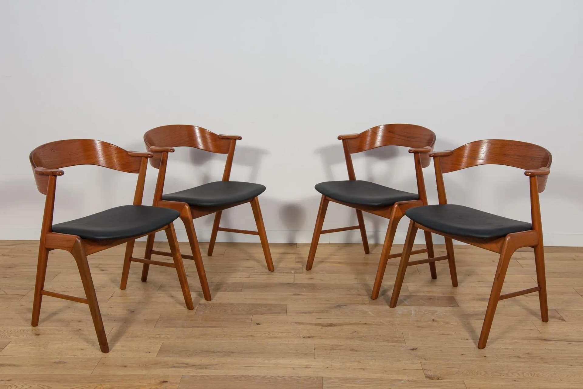 Set of four chairs, brown teak, black leather, Denmark, 1960s. - 70959