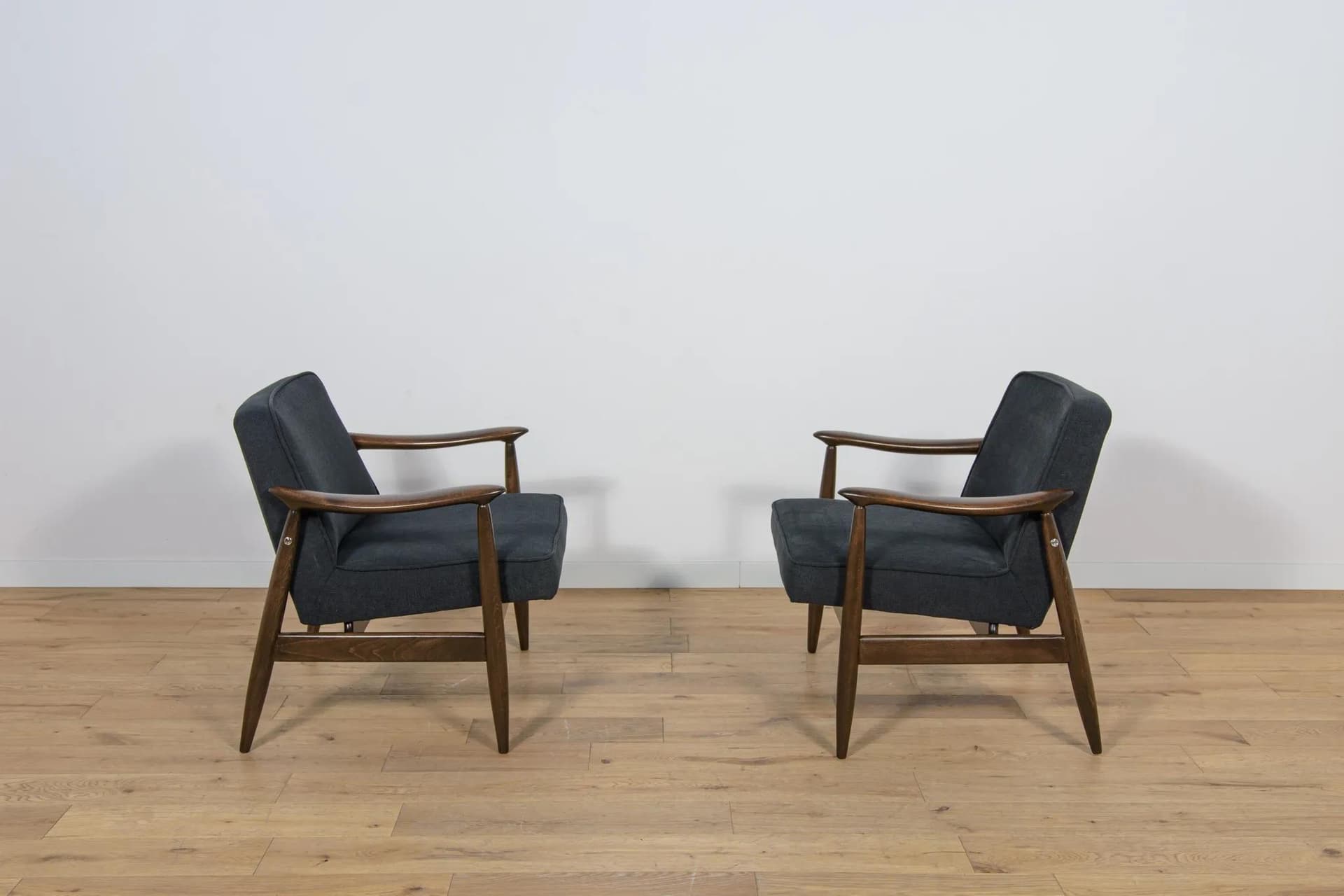 Pair of armchairs GFM-87, brown wood, black fabric, by J. Kędziorek, Poland, 1970s. - 70472