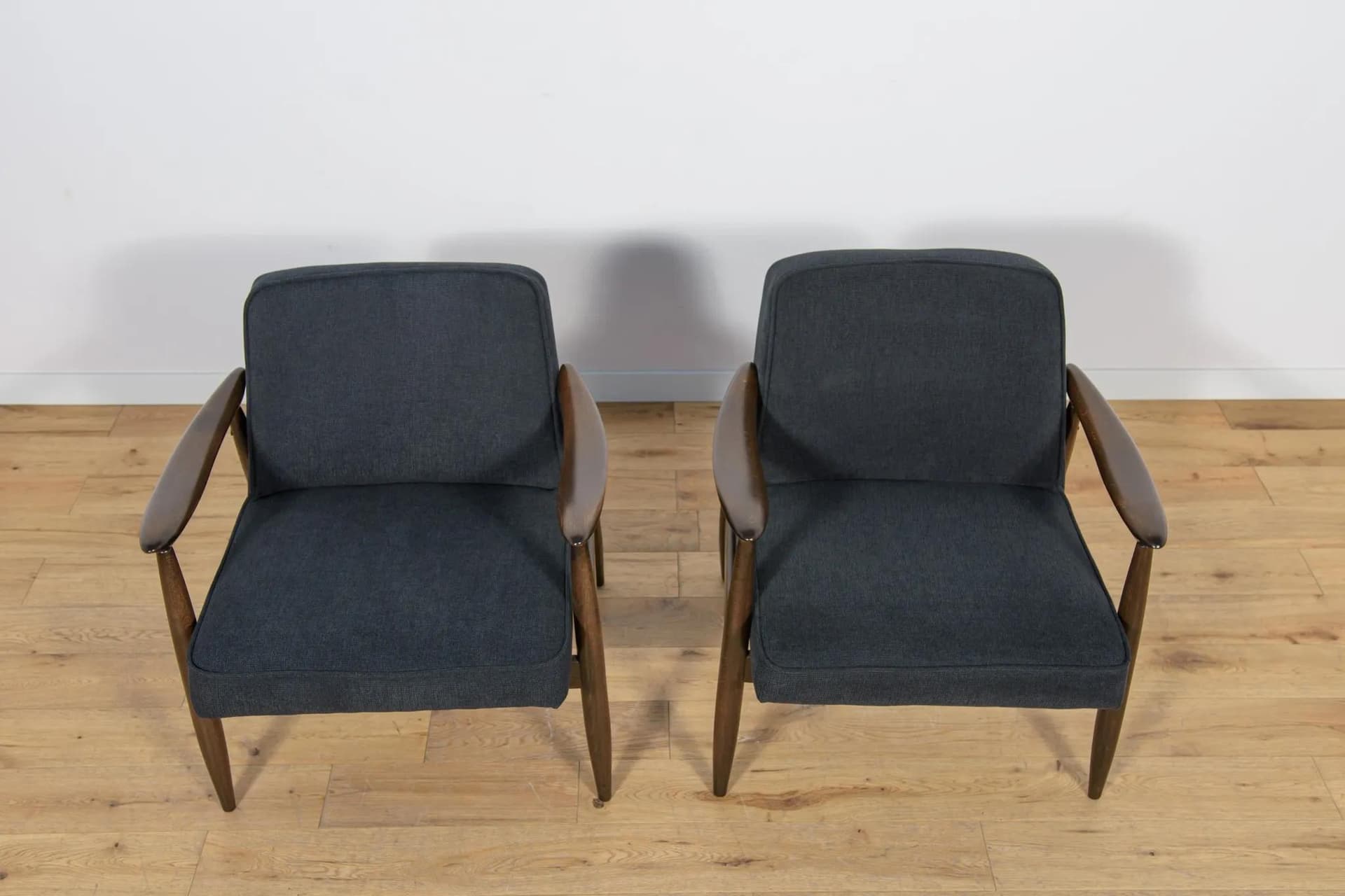 Pair of armchairs GFM-87, brown wood, black fabric, by J. Kędziorek, Poland, 1970s. - 70468