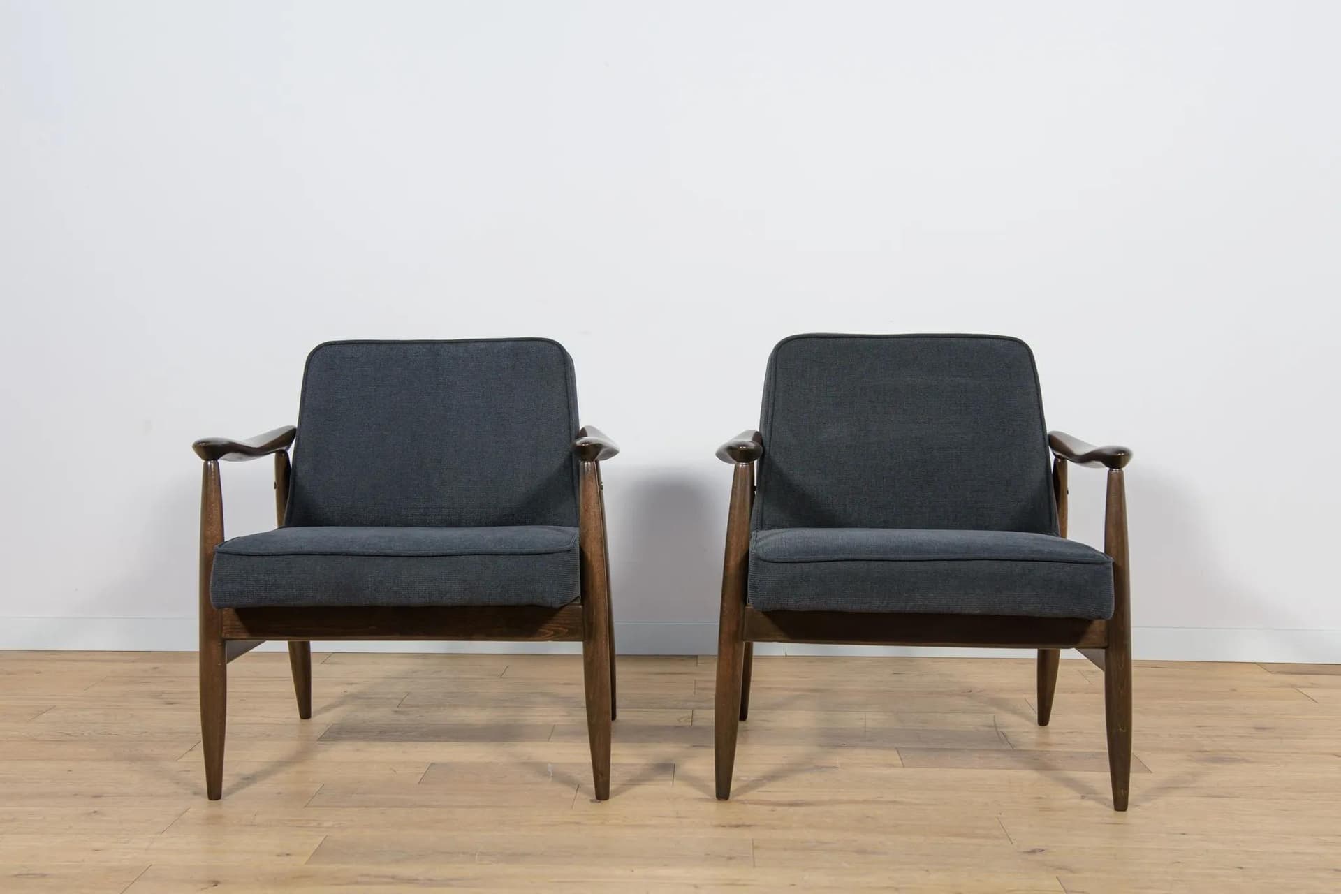Pair of armchairs GFM-87, brown wood, black fabric, by J. Kędziorek, Poland, 1970s. - 70469