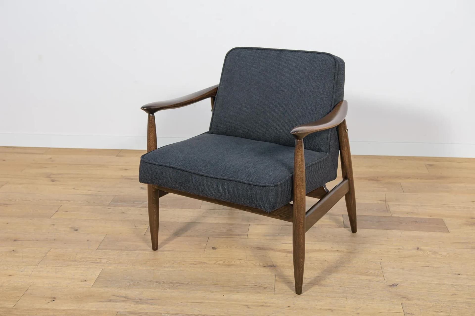 Pair of armchairs GFM-87, brown wood, black fabric, by J. Kędziorek, Poland, 1970s. - 70470