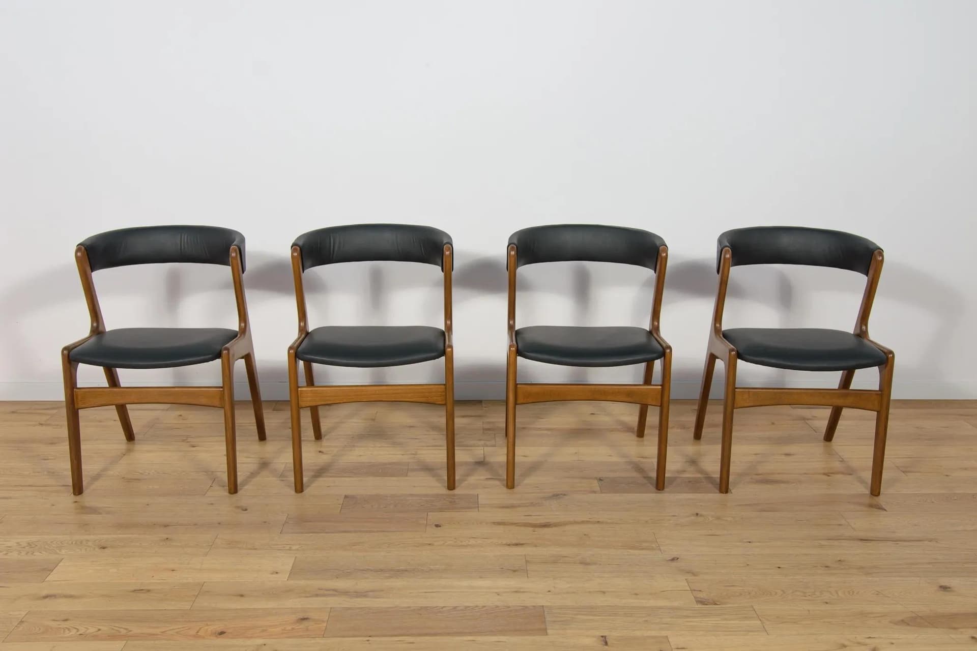 Set of four chairs, brown beech, black leather, Denmark, 1960s. - 73887