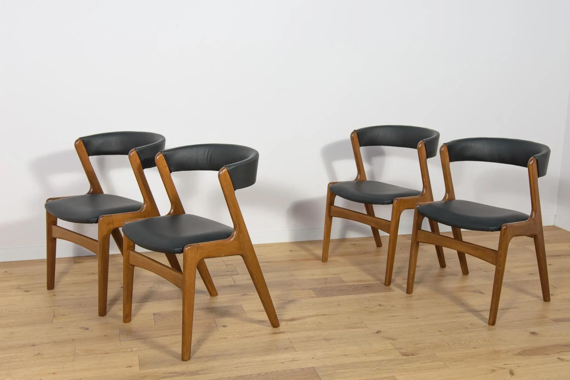 Set of four chairs, brown beech, black leather, Denmark, 1960s. - 73889