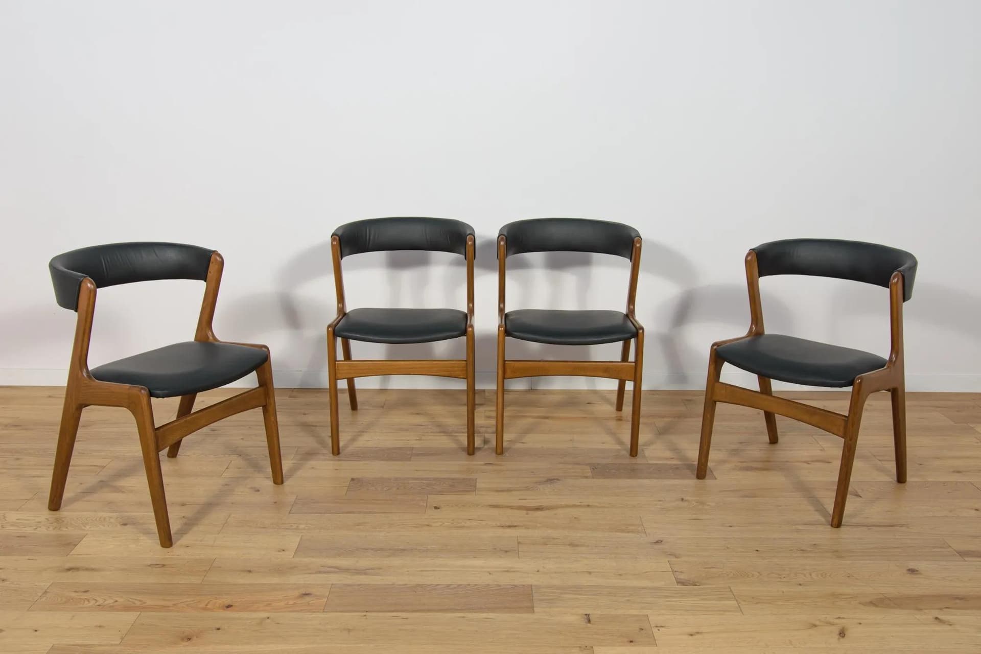 Set of four chairs, brown beech, black leather, Denmark, 1960s. - 73886