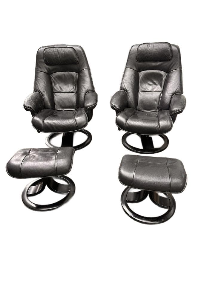 Set of two armchairs with ottomans Stressless Ekornes, black leather, black wood, Norway, 1980s.