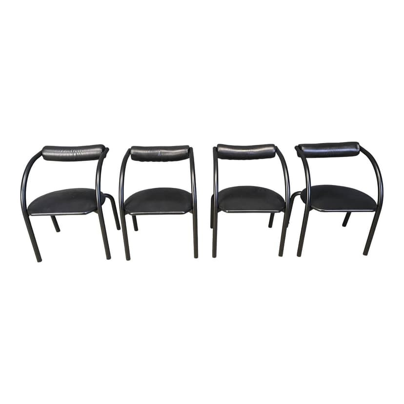 Set of four postmodern dining chairs, black metal, black leatherette, Italy, 1980s.