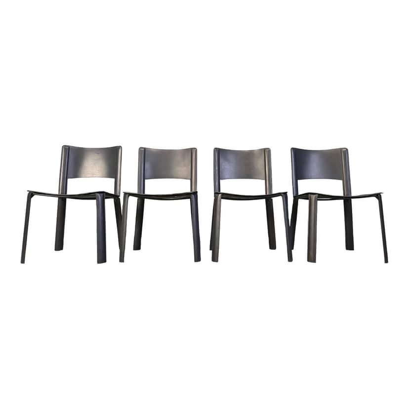Set of four dining chairs, black leather, Italy, 1980s.