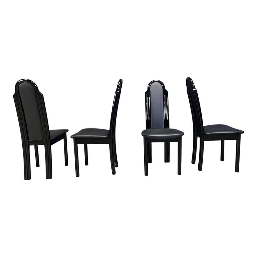 Set of four postmodern dining chairs, black wood, black faux leather, Italy, 1980s.