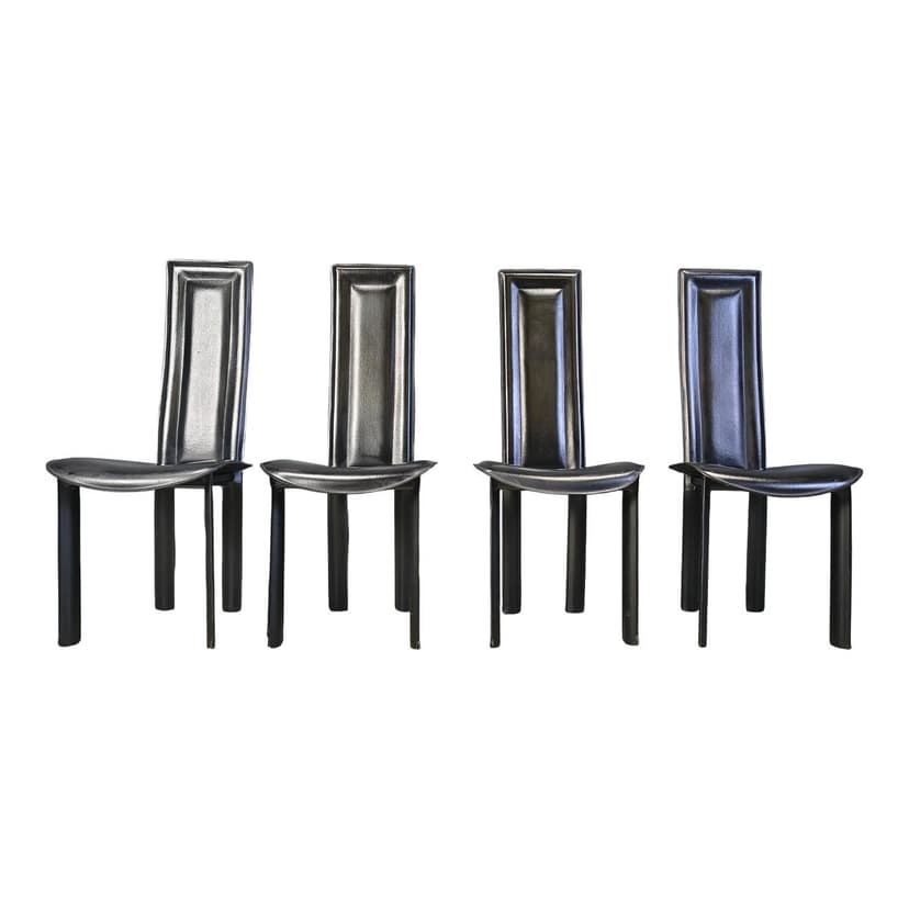 Set of four dining chairs, black leather, Italy, 1980s.