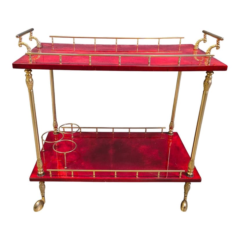 Bar cart, burgundy lacquered goatskin, gold metal, by A. Tura, Italy, 1970s.