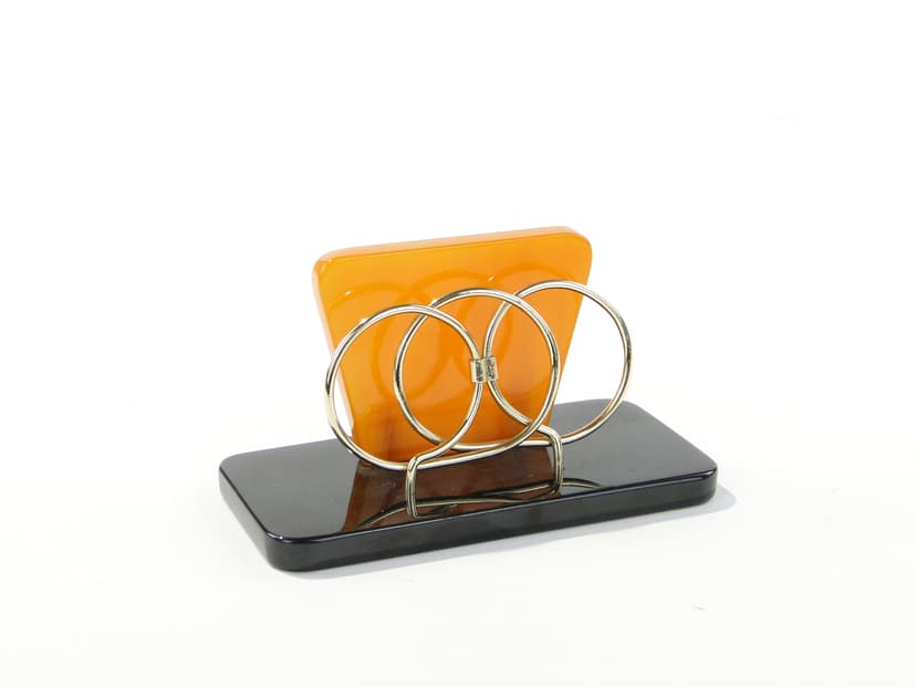 Napkin Holder, black and orange Bakelite, gold brass, Switzerland, 1960s.
