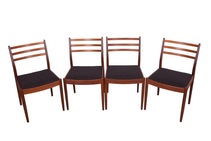 Set of four chairs, brown teak, black synthetic fabric, by V. Wilkins, G-Plan, United Kingdom, 1960s.