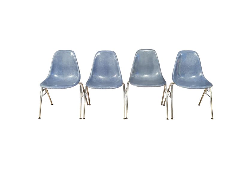 Set of four DSS chairs, blue fiberglass, silver chrome, by C. & R. Eames, Herman Miller, USA, 1970s.