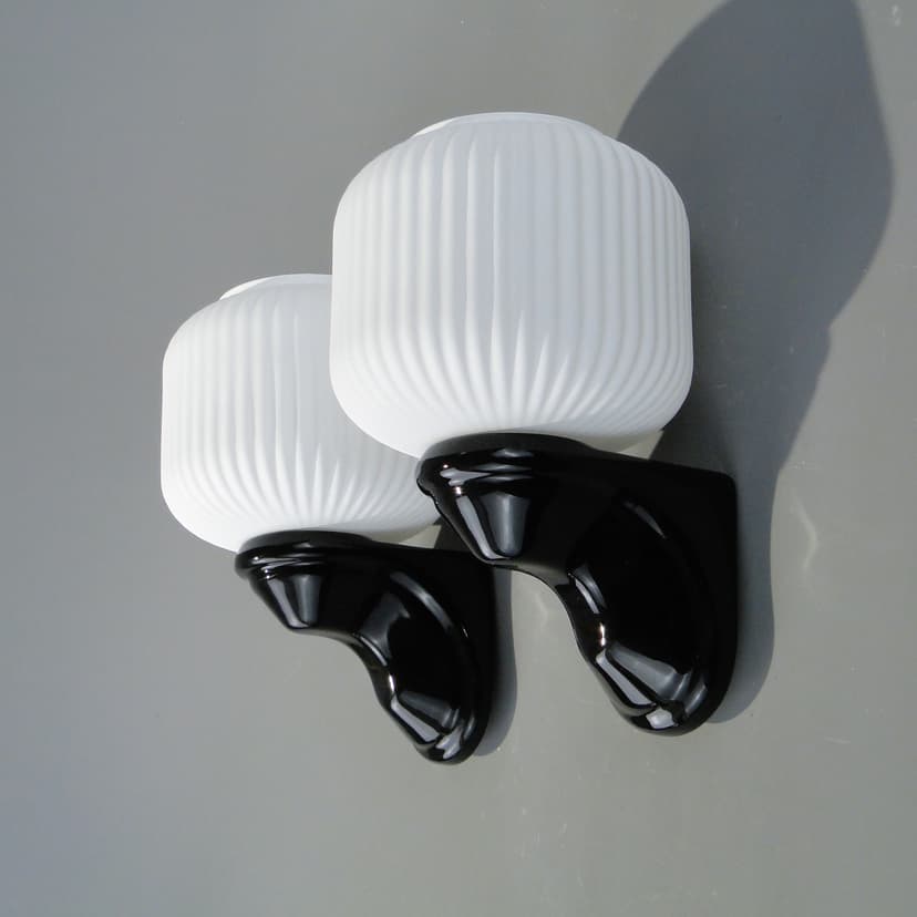 Pair of wall sconces, black ceramic, white glass, Poland, 1970s