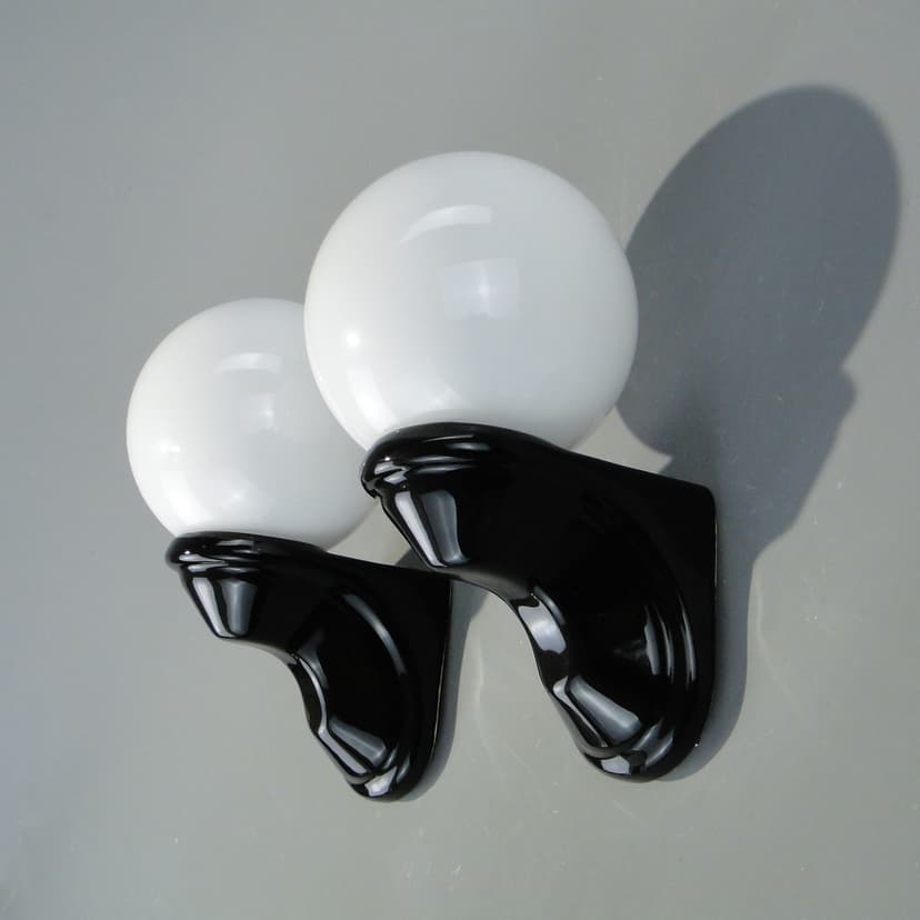 Pair of wall sconces, black ceramic, white glass, Poland, 1970s.