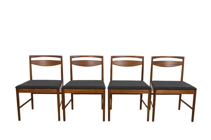 Set of four chairs Model 9513, brown teak, black fabric, by T. Robertson, for A.H. McIntosh & Co., United Kingdom, 1970s.
