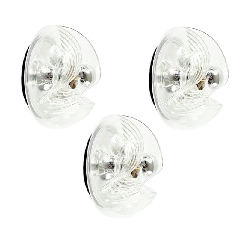 Set of three wall sconces Wave/Futura, transparent glass, silver aluminium, Peill & Putzler, Germany, 1970s.